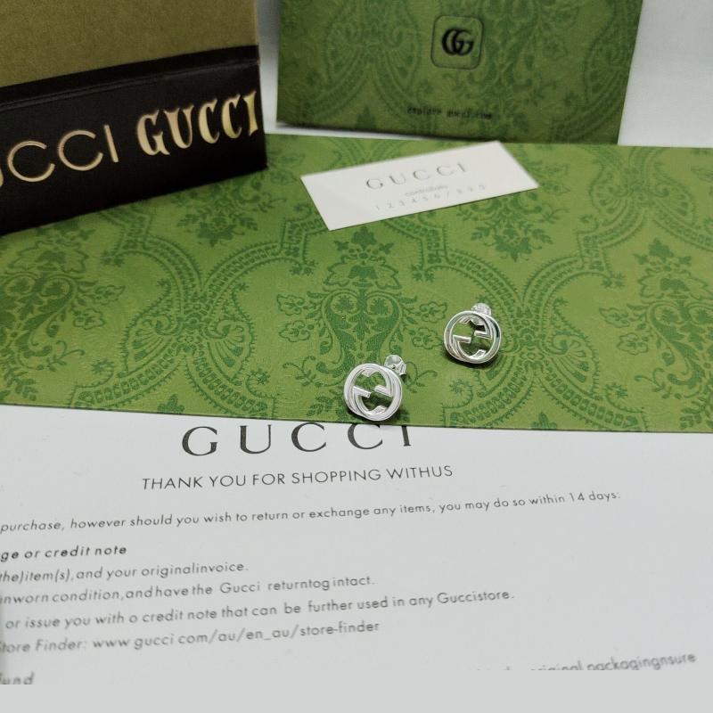 G*u*i earrings